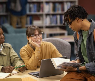 colleagues-studying-university-library-min